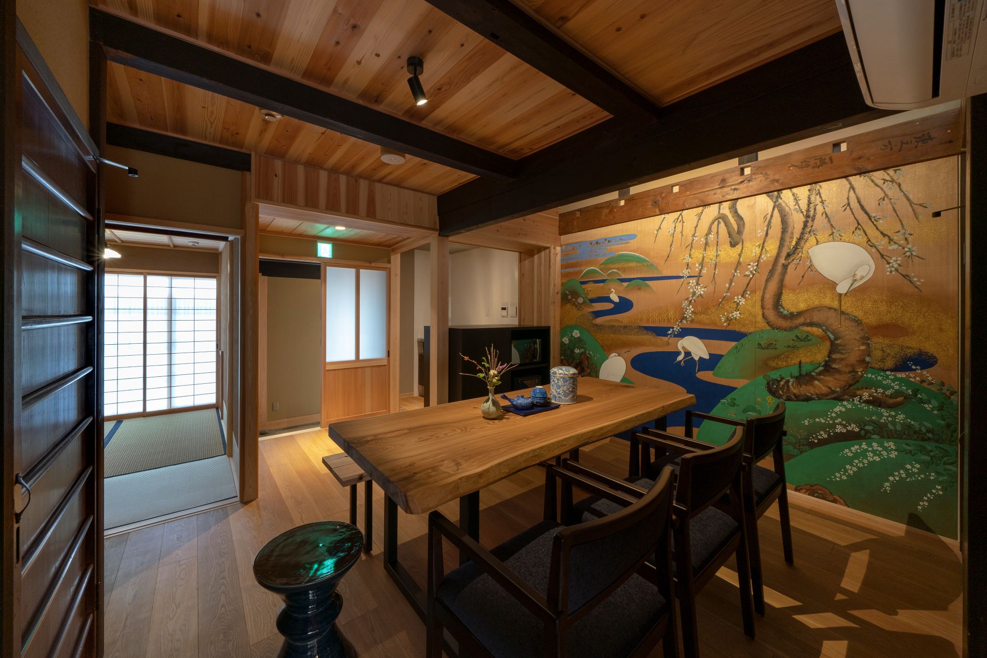 Renovated dining room and kitchen area of a traditional Japanese house in Kyoto.